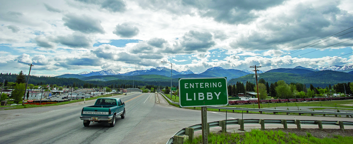 A sign welcomes visitors to Libby, Montana.