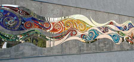 An art mosaic decorates an outside space. 