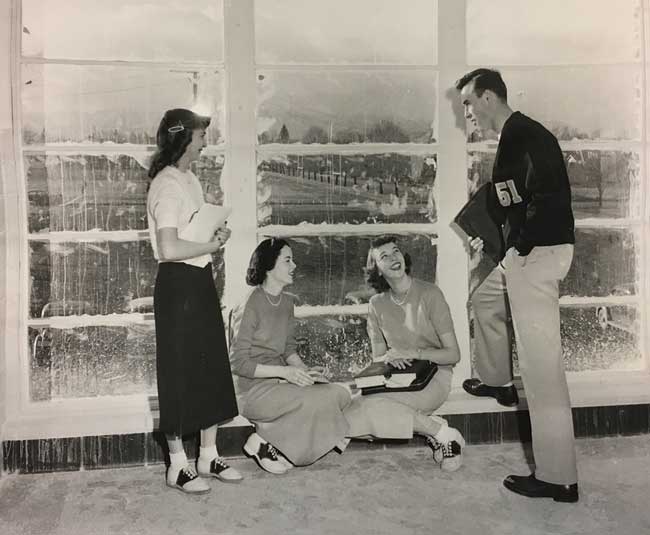 Saddle shoe-wearing students tour the UM business building built in 1950.