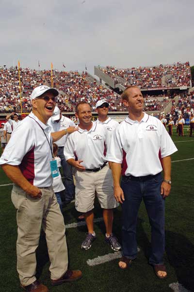 Dickenson (right) was recognized at Washington-Grizzly Stadium for the 10th anniversary of the 1995 championship win along with former coach Don Read (left) and teammate Matt Wells.