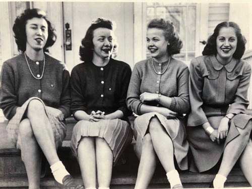 Donna Fanning ’48, from Butte, McGee, Billie McDonald Carvey ’48, and Marjorie Splan Stapp ’45, all from Great Falls, sit on the steps of UM’s Kappa Alpha Theta House circa 1945.
