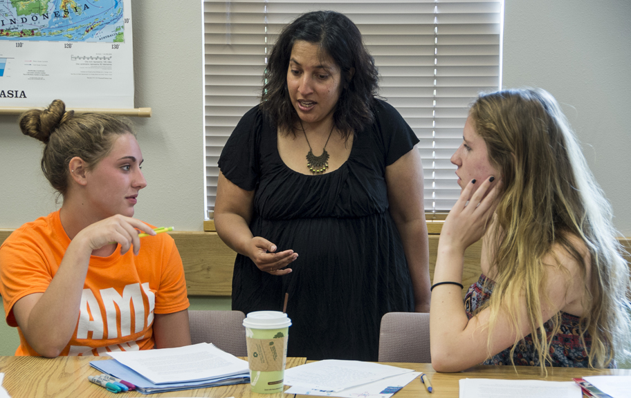 UM Associate Professor Prageeta Sharma talks with student in her Introduction to Creative Writing course. 
