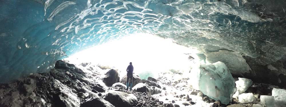 Lee-Gray Boze ’07, who earned a geosciences undergraduate degree from UM, explores  the interior of a glacier in Alaska’s Wrangell  St. Eilias National Park  and Preserve. 