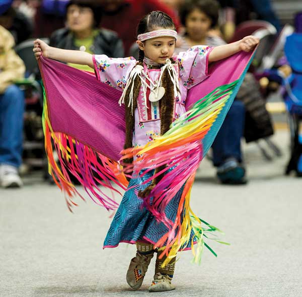 Five-year-old Cianna Belle DesRosier of Browning (Maatsui Suipoyaukii “Loon Woman” in Blackfeet) enjoys UM’s 50th annual Kyiyo Celebration. 