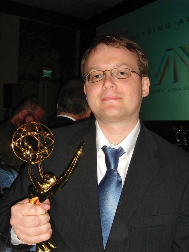 Michael Babock ’98 holds an Emmy Award for his Henson Digital Performance System animation software