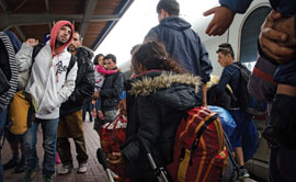 Syrian refugees arrive at Dortmund Central Station in western Germany last summer. At the peak of the past year’s refugee crisis in Europe, it was reported that almost 10,000 people a day sought asylum in Germany. (Photo by Shane Thomas McMillan)