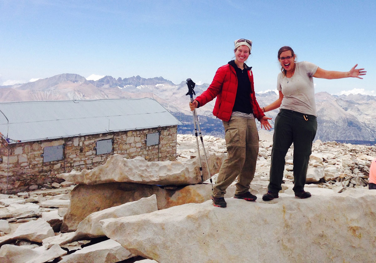 Emily “Smokey” Brine, left, poses triumphantly atop the 14,505-foot Mount Whitney with her hiking partner Shelly “Queen B” Bruecken on July 23, 2015. 