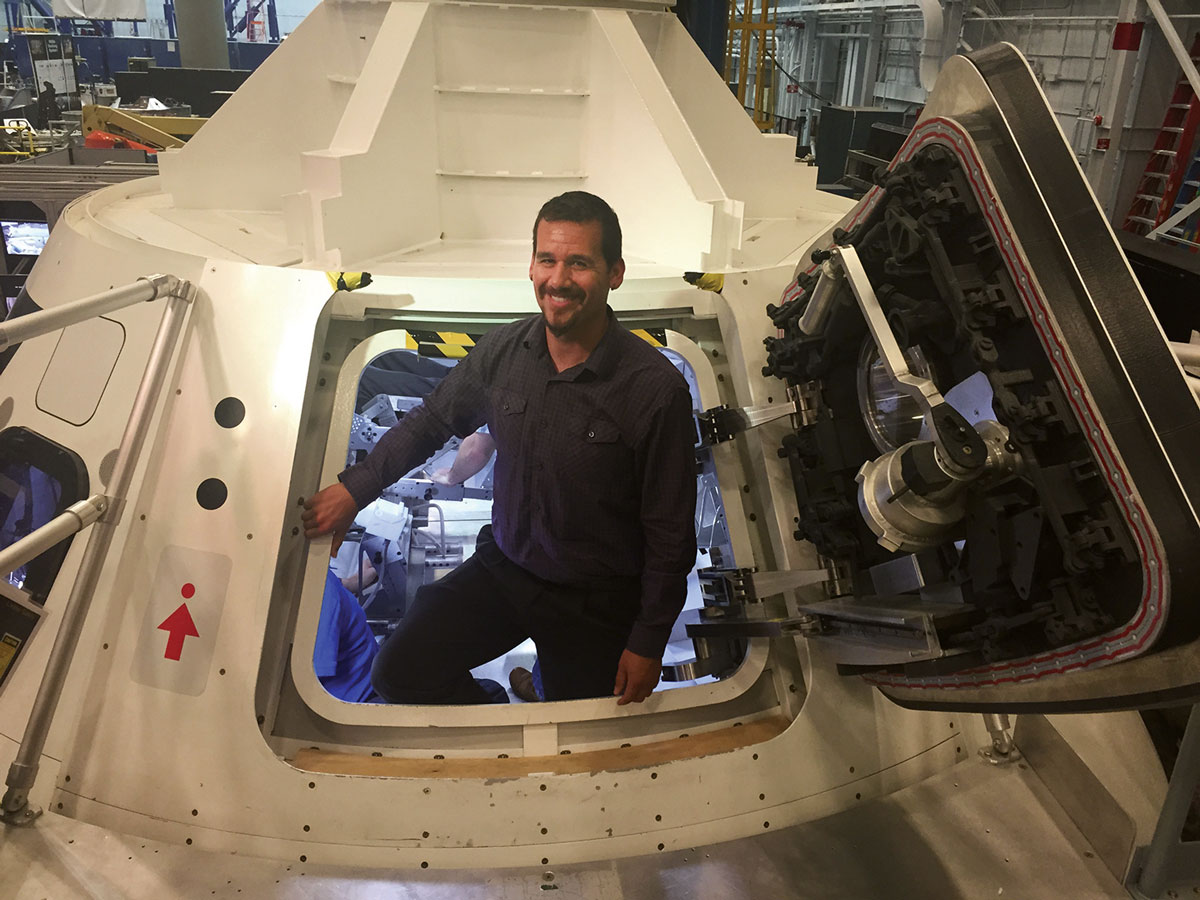 Daniel Baca stands inside the mockup version of the Orion spacecraft used for training at Johnson Space Center in Houston.