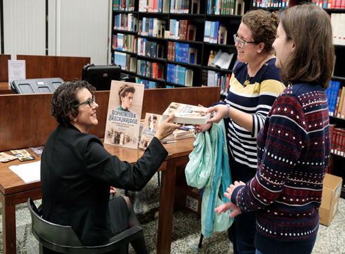 egents Professor of History Anya Jabour signs a copy of her new book for fans