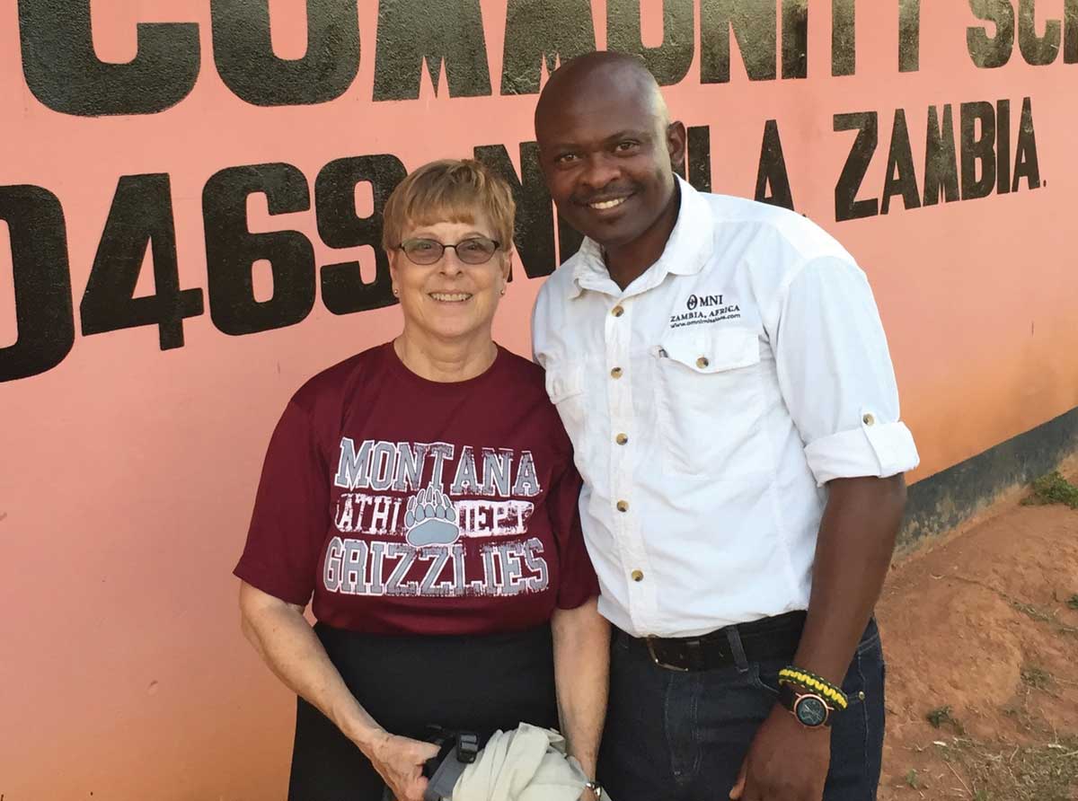 Judy Kazak ’67 sports her Griz T-shirt on a trip to Africa.