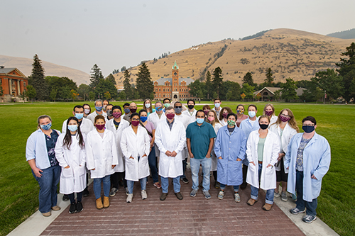 A group of lab scientists in white coats