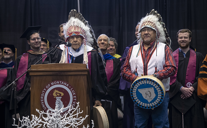 Native elders at the graduation podium