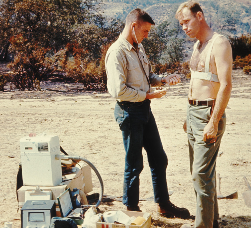 MTDC Employee Cliff Blake, right, is a subject during a study of the demands of wildland firefighting in 1965.
