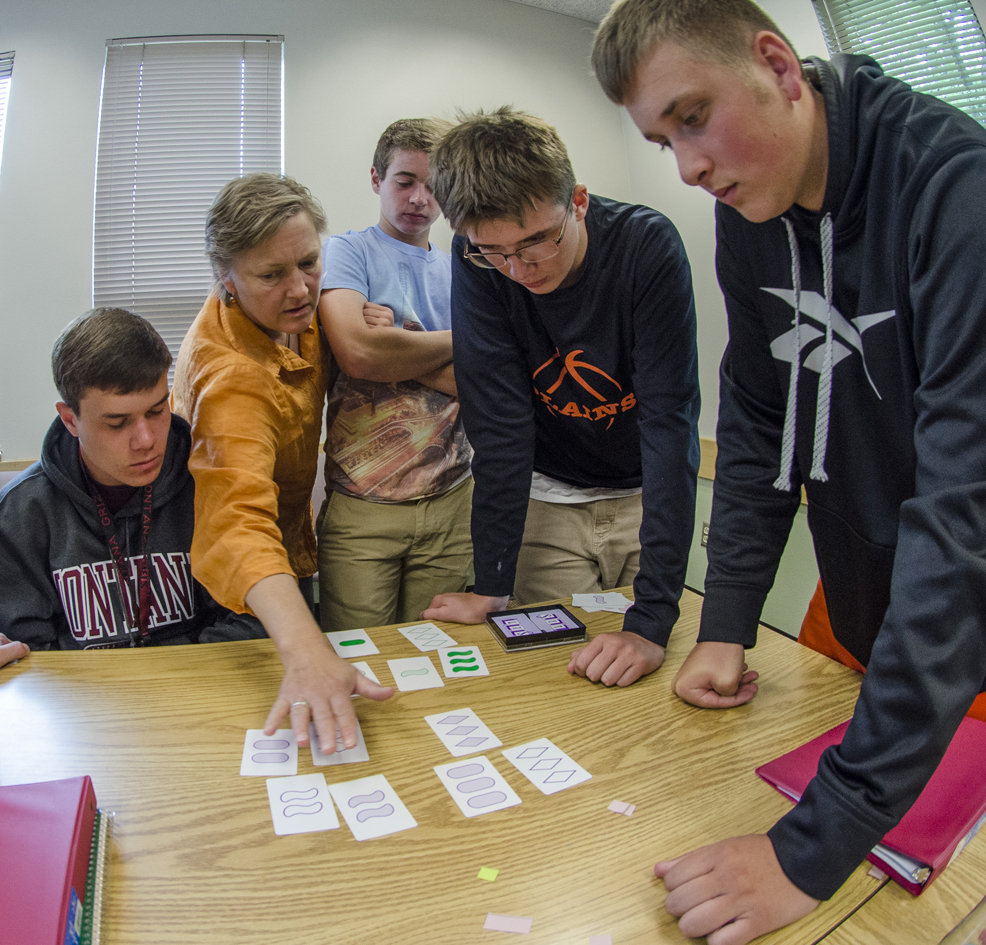 Jenny McNulty, associate dean of UM’s College of Humanities and Sciences and a mathematics professor, works with students in her Discrete Mathematics course. 