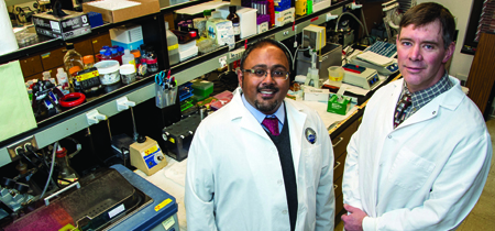 Sarj Patel and Tom Rau standing in a lab