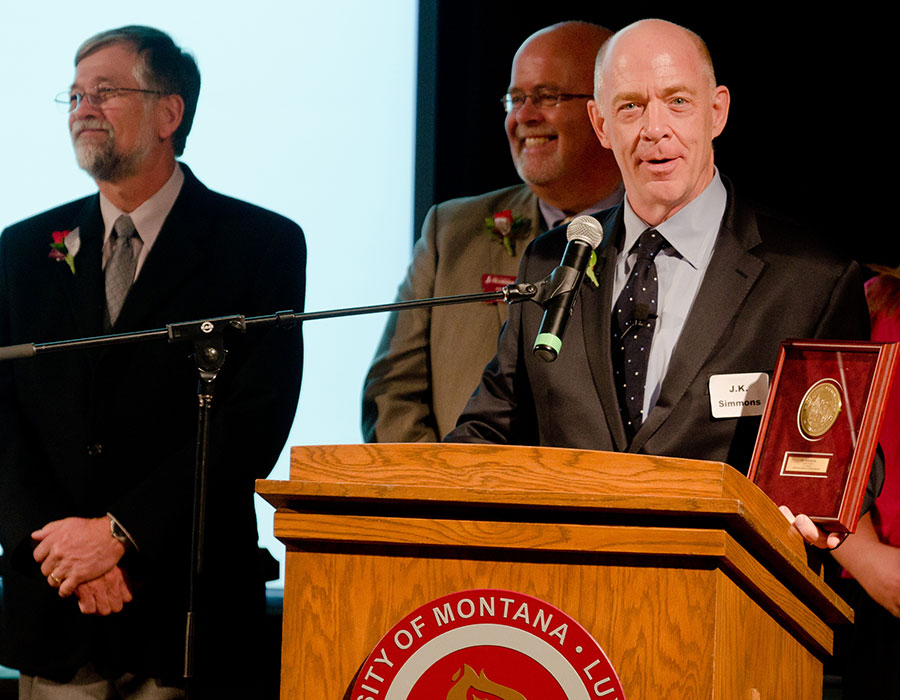 J.K. Simmons '78 accepts an award from UM President Royce Engstrom. (Photo by Todd Goodrich)