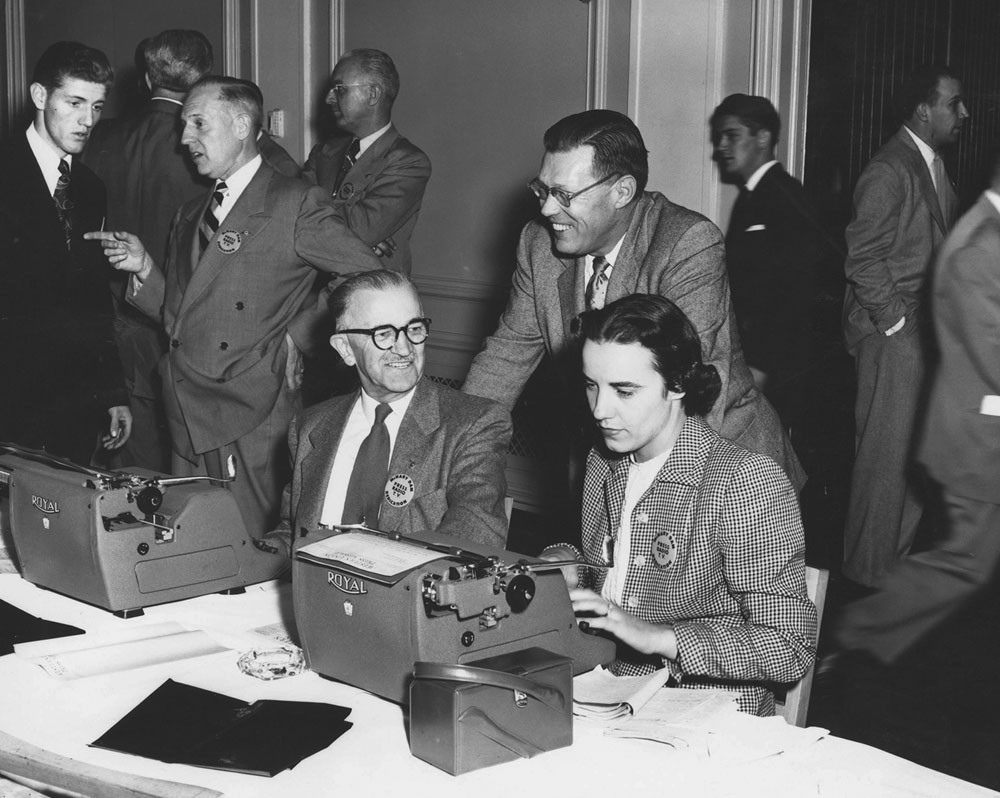 Dorothy Rochon Powers was one of the few women reporters assigned to President Dwight D. Eisenhower’s dedication of McNary Dam. Busy filing a story on the president’s arrival, she chats with Press Secretary James Hagerty in the press room at the Marcus Whitman Hotel in Walla Walla, Wash., in October 1954.
