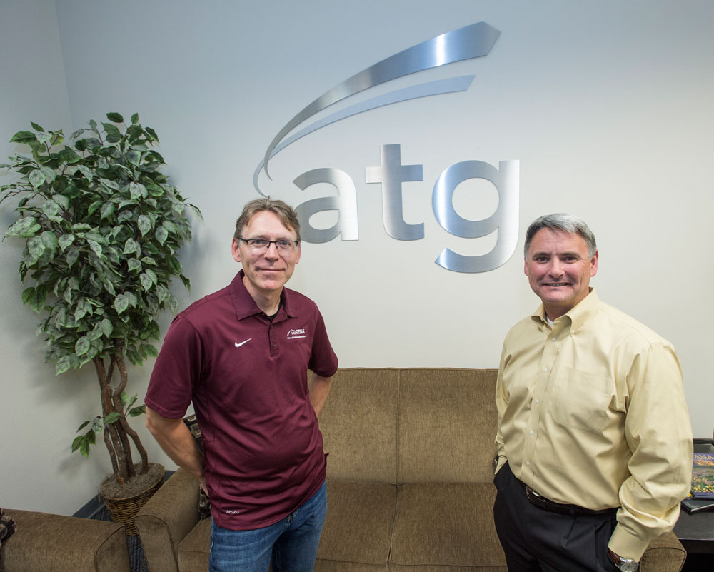 UM Professor David Firth, left, and Tom Stergios, vice president of Advanced Technology Group, have created a unique partnership that helps keep talented UM graduates in Montana working high-paying, high-tech jobs.