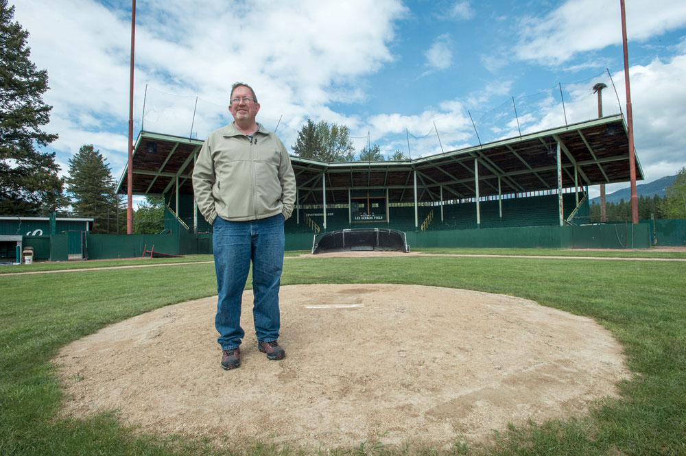 Lincoln County Commissioner Mark Peck stands on the mound of Libby’s American Legion baseball field. Peck contacted UM’s School of Business Administration about helping with the rebranding effort.