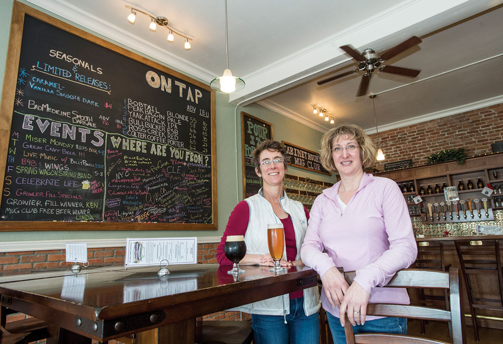 Kristin Smith, who earned a master’s degree at UM, left, and Sarah Dinning  are co-owners of the popular Cabinet Mountain Brewing Co.
