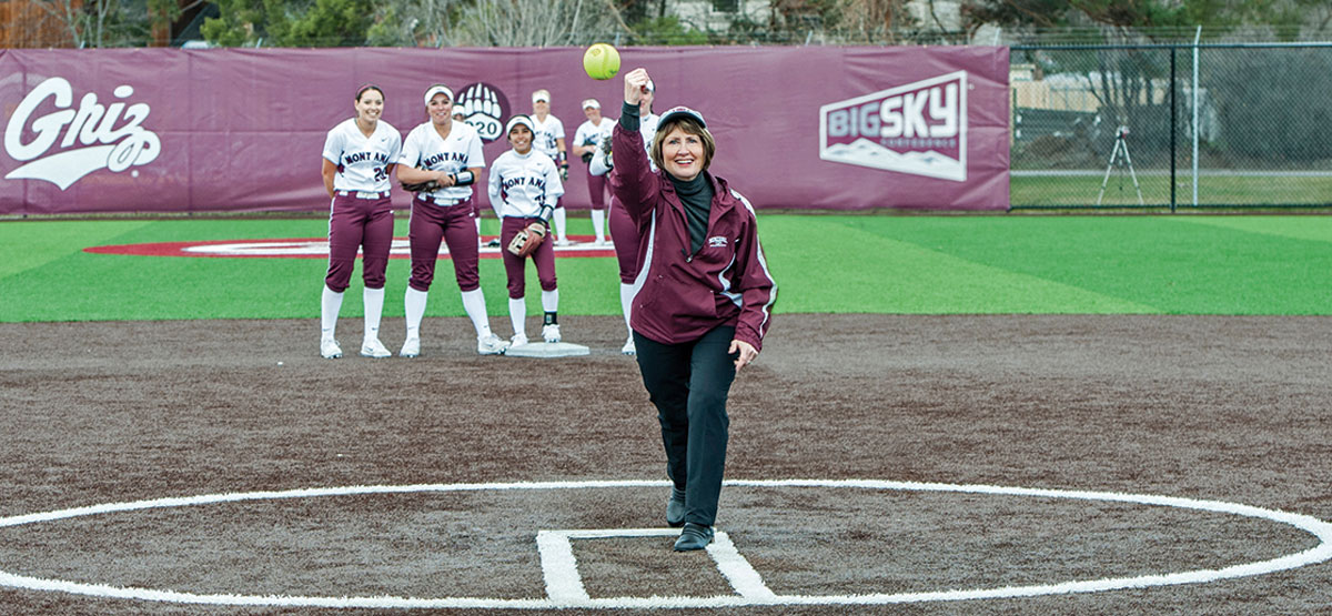 UM President Sheila Stearns throws out the first pitch of a Grizzly softball game.