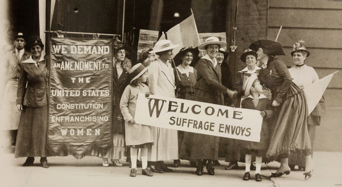 Women attend a rally in support of suffrage in the 1900s.