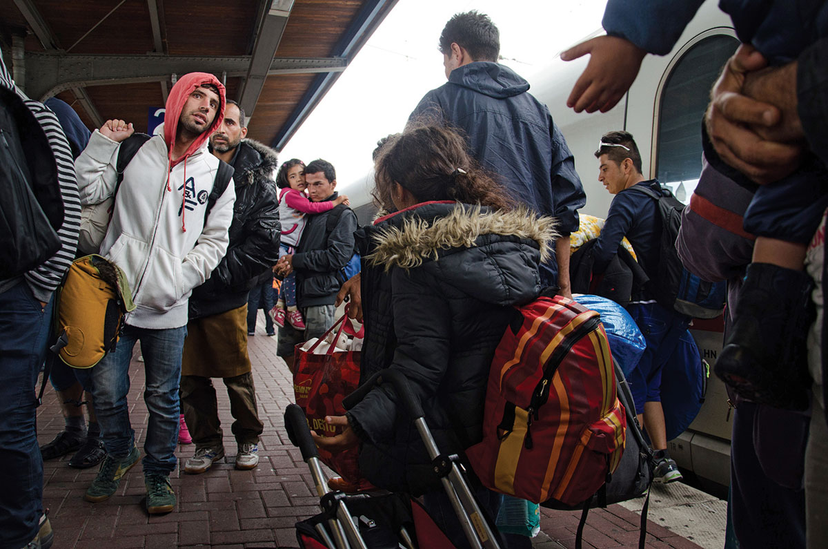 Syrian refugees arrive at Dortmund Central Station in western Germany last summer. At the peak of the past year’s refugee crisis in Europe, it was reported that almost 10,000 people a day sought asylum in Germany. (Photo by Shane Thomas McMillan)