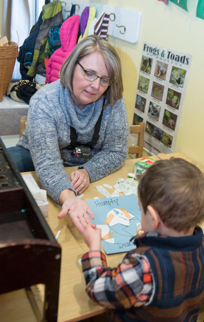 UM master’s student Irene Tiefenthaler works with a student in her class at Spirit at Play daycare in Missoula.